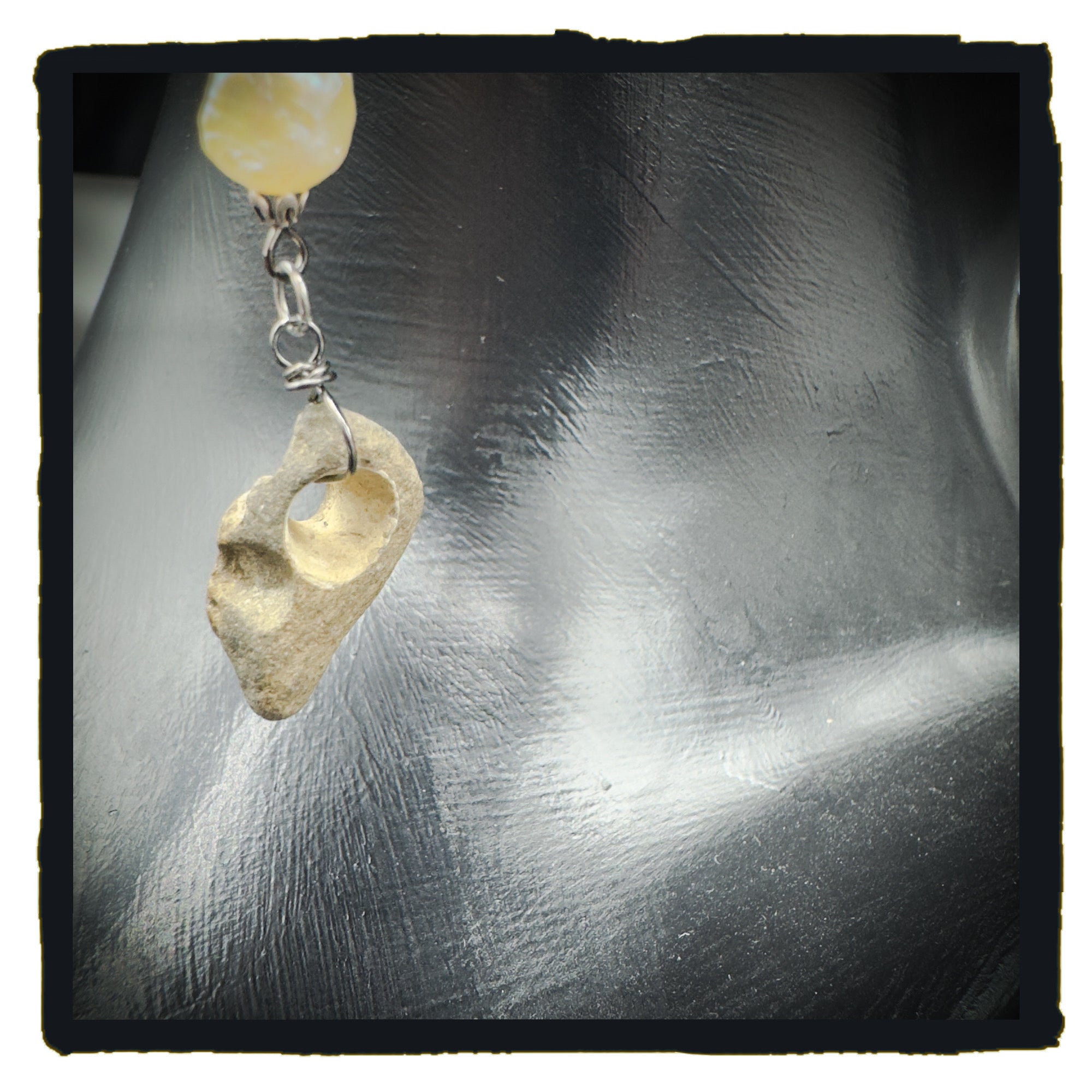 Pearl and Hag Stone eyewear chain