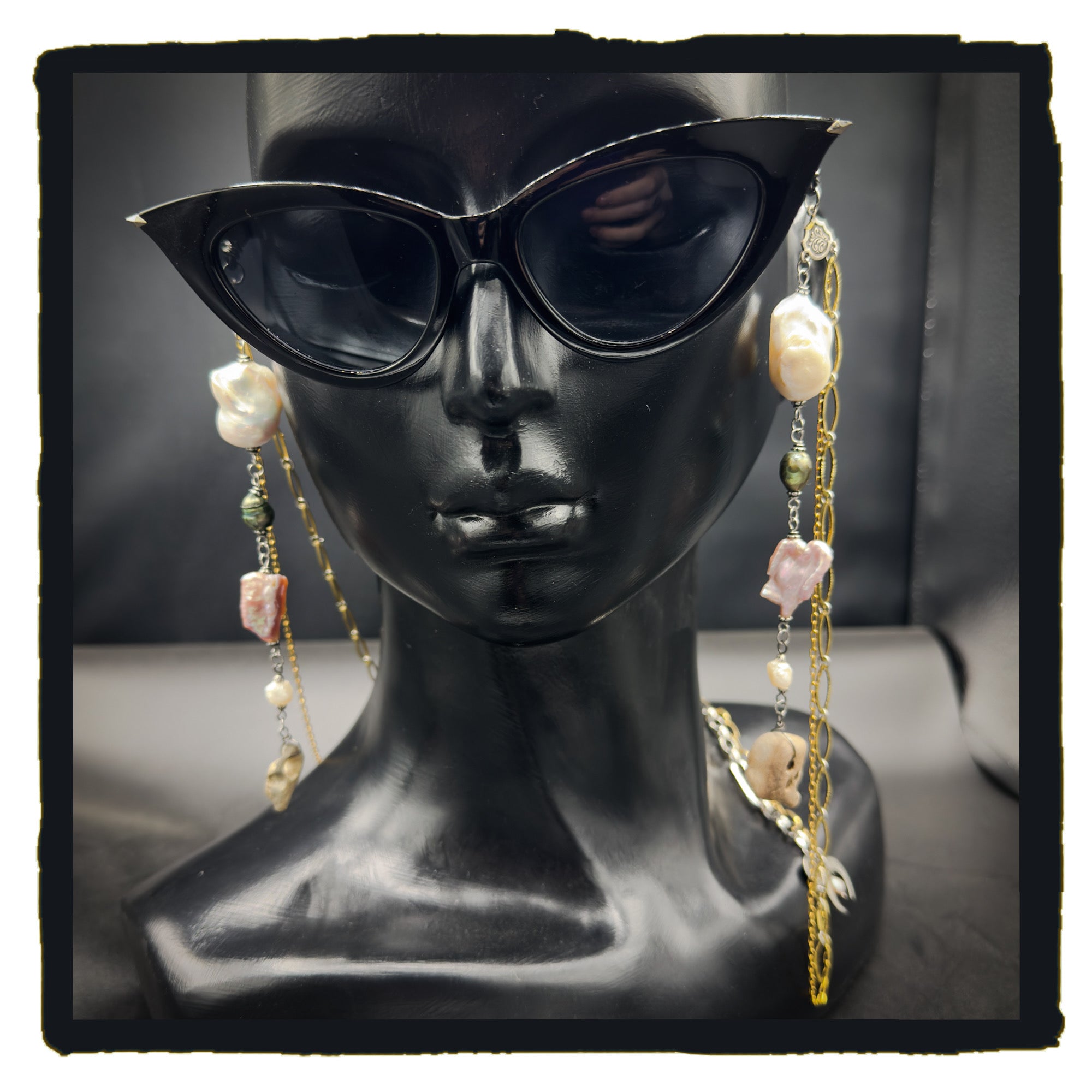 Pearl and Hag Stone eyewear chain
