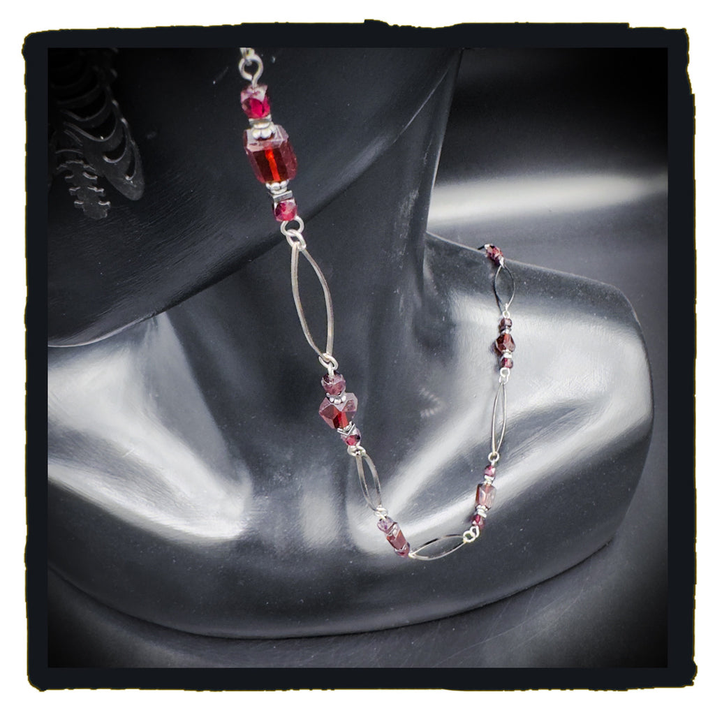 The Garnet in My Chest eyewear chain